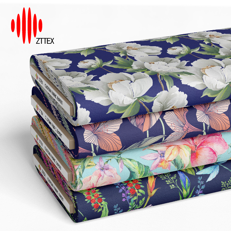 Stack of ZTTEX custom printed fabric bolts with floral patterns